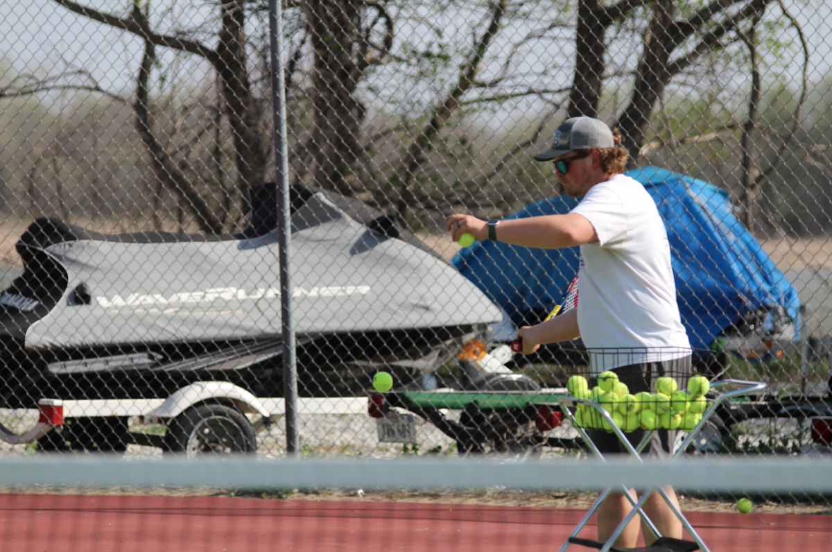 For the show: Coach Alex Nielsen demonstrates a swing technique.

